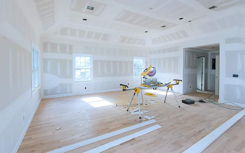 An open room measured out before a drywall quote